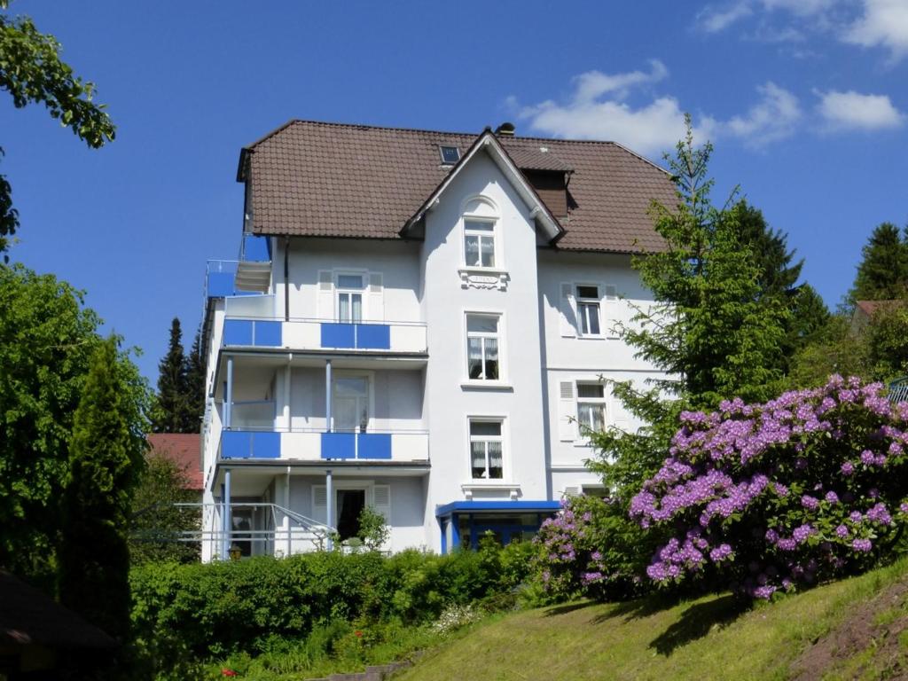 a large white house with a large window at Hotel Fidelitas in Bad Herrenalb