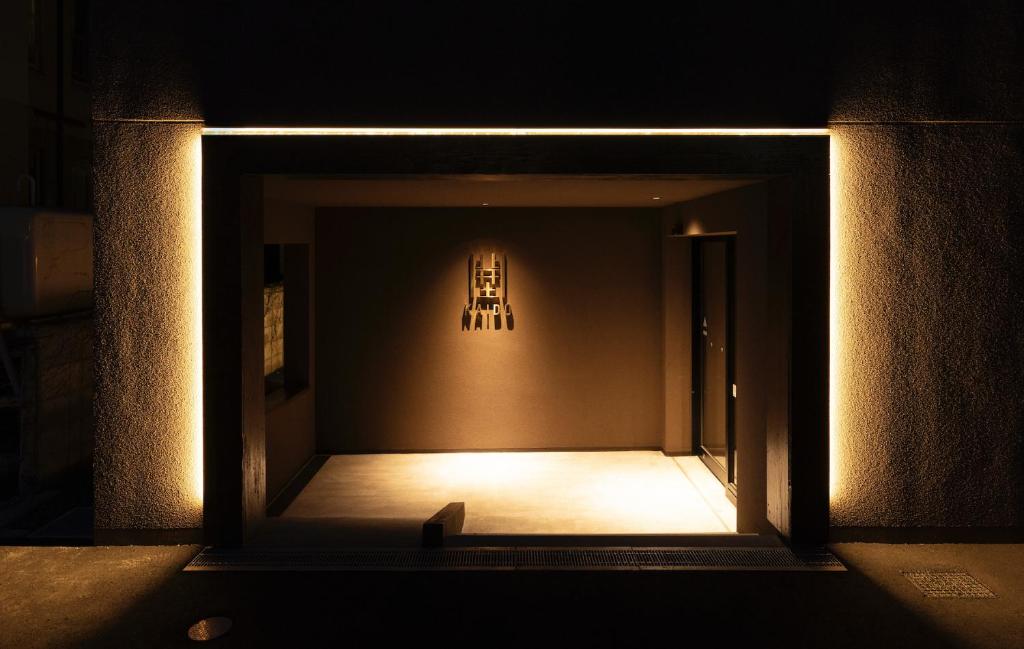 a hallway with a light in a dark room at 開土 KAIDO Hotel in Sapporo