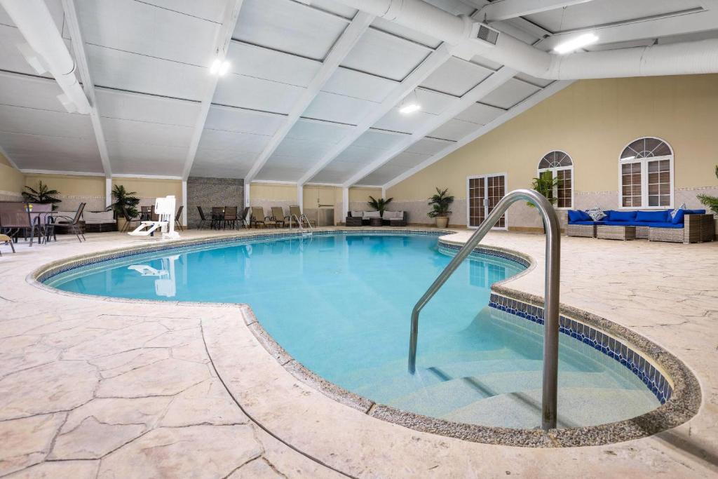 a large swimming pool in a hotel room at Days Hotel by Wyndham Toms River Jersey Shore in Toms River
