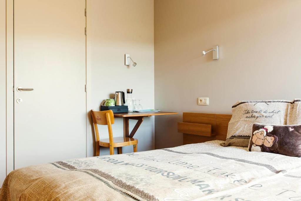 Postel nebo postele na pokoji v ubytování Hoevehotel Ronse