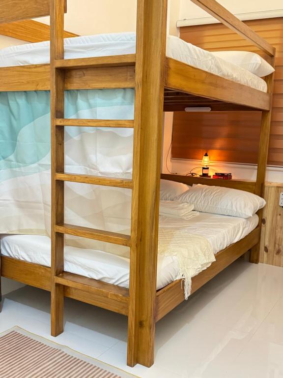 a bunk bed room with bunk beds in a house at Spacious Bunk Bed & Dedicated Workspace in Baler