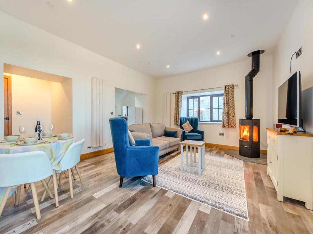 a living room with a couch and a table at Ty Gwair - Uk41512 in Lampeter