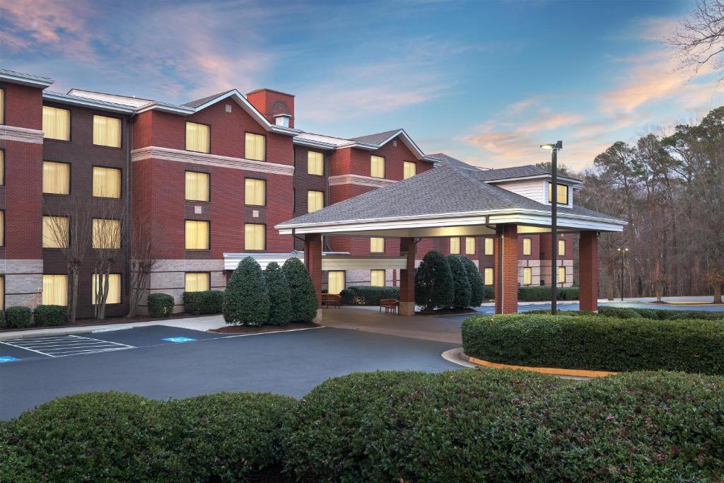a rendering of a hotel with a parking lot at Homewood Suites Williamsburg in Williamsburg