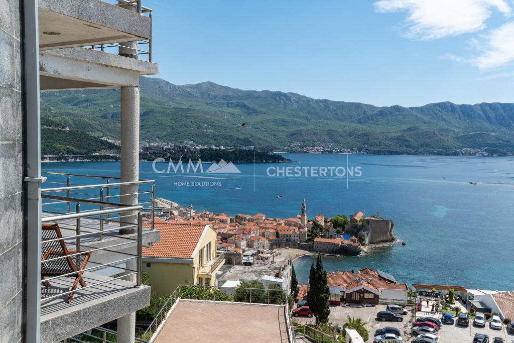 a view of a town and a body of water at Blue Seacliff Luxe in Komoševina