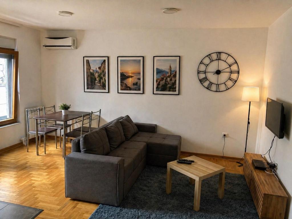 a living room with a couch and a table at Apartman 4 you 4 in Belgrade