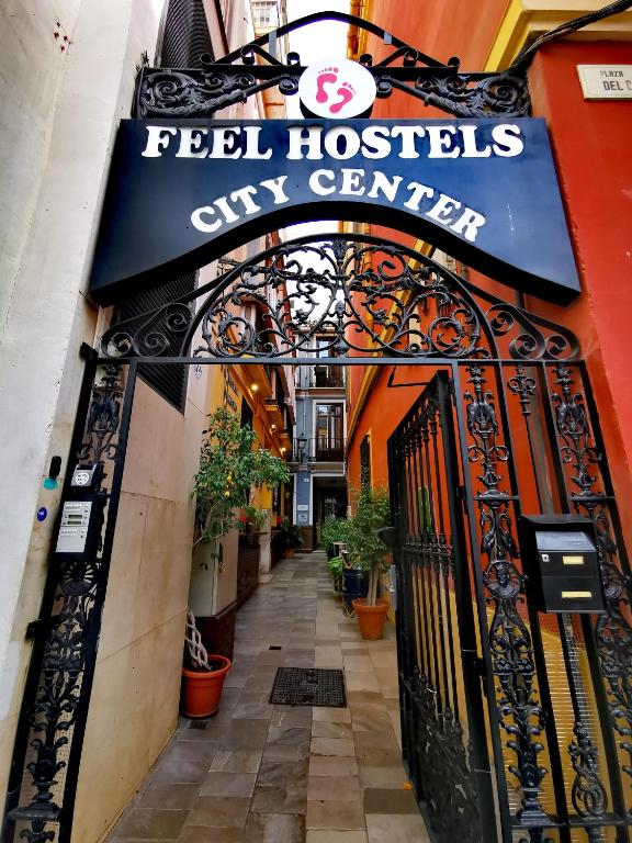 an entrance to a city center with a sign that reads pet hospital city center at Feel Hostels City Center in Málaga