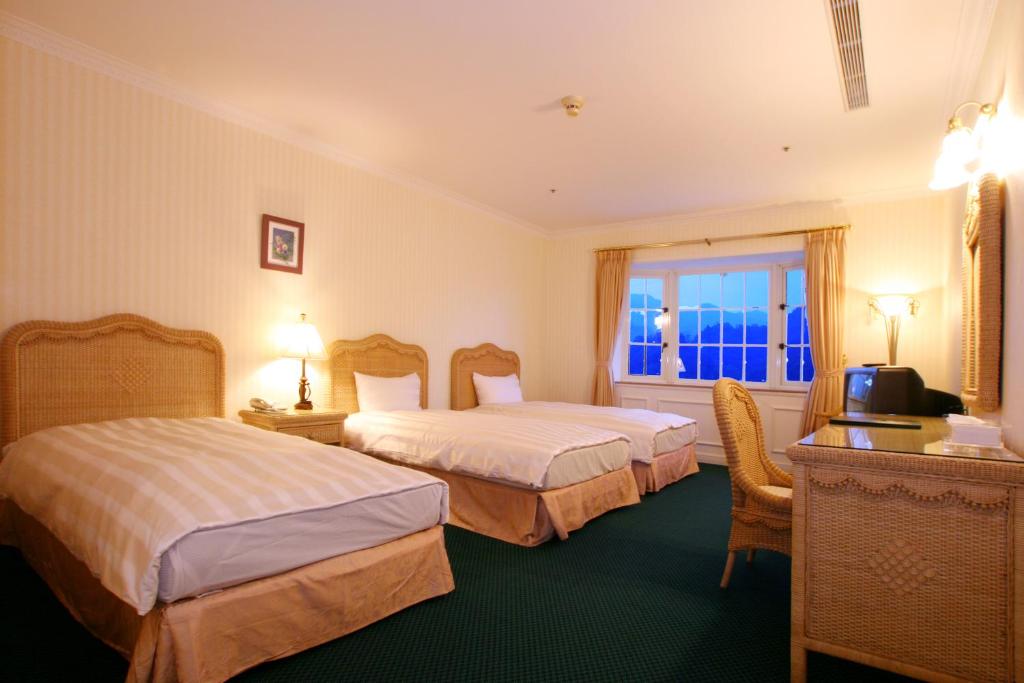 Postel nebo postele na pokoji v ubytování Life Leisure Resort