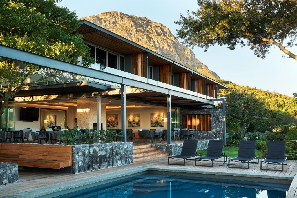 a house with a pool in front of it at Spanish Farm Boutique Hotel & Villas in Somerset West