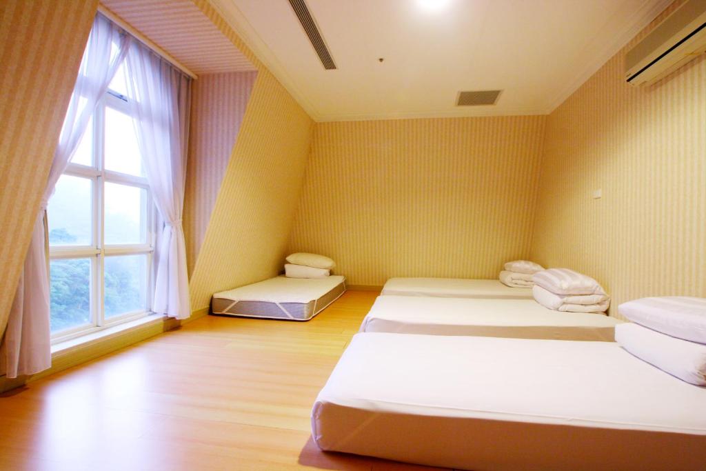 Postel nebo postele na pokoji v ubytování Life Leisure Resort