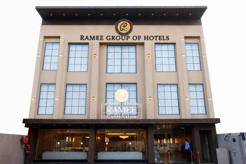 a man is standing in front of a building at Ramee ColleXtion Amritsar, Near Golden Temple in Amritsar