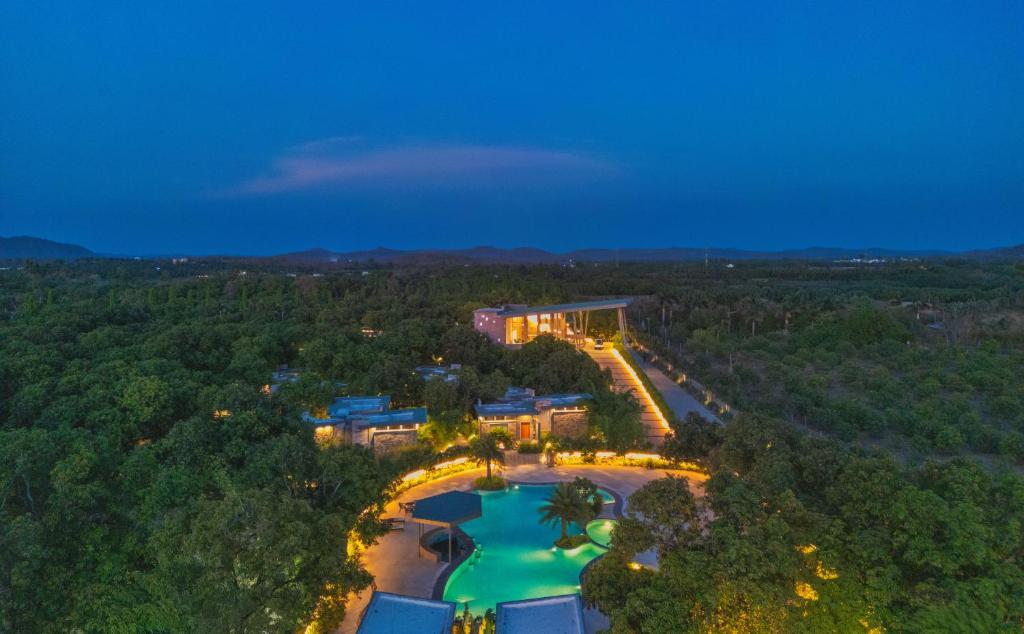 an aerial view of a resort at night at The Forest Chapter by Sayaji Sasan Gir in Chitrod