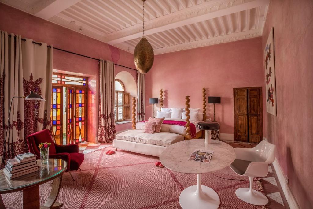 a living room with a couch and a table at El Fenn in Marrakesh
