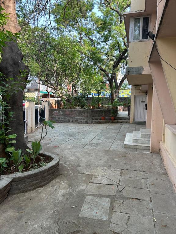 an empty parking lot in front of a building at Leos Inn in Pune