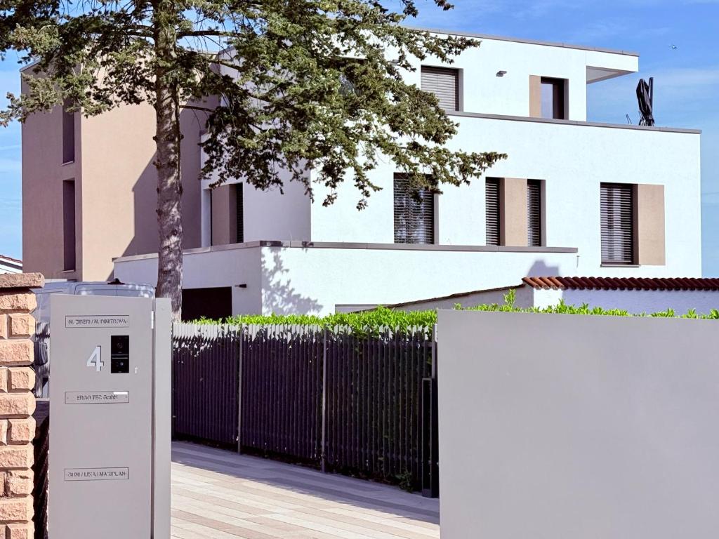 an electrical box in front of a white house at RheinView Residence - Apartment in Mainz