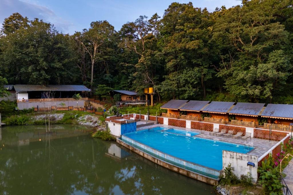 an aerial view of a house with a swimming pool at Dandeli Kali Resort in Dandeli