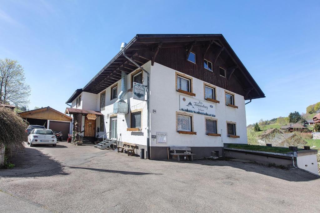a large white building with a gambrel roof at Haus Tannenberg in Todtnau