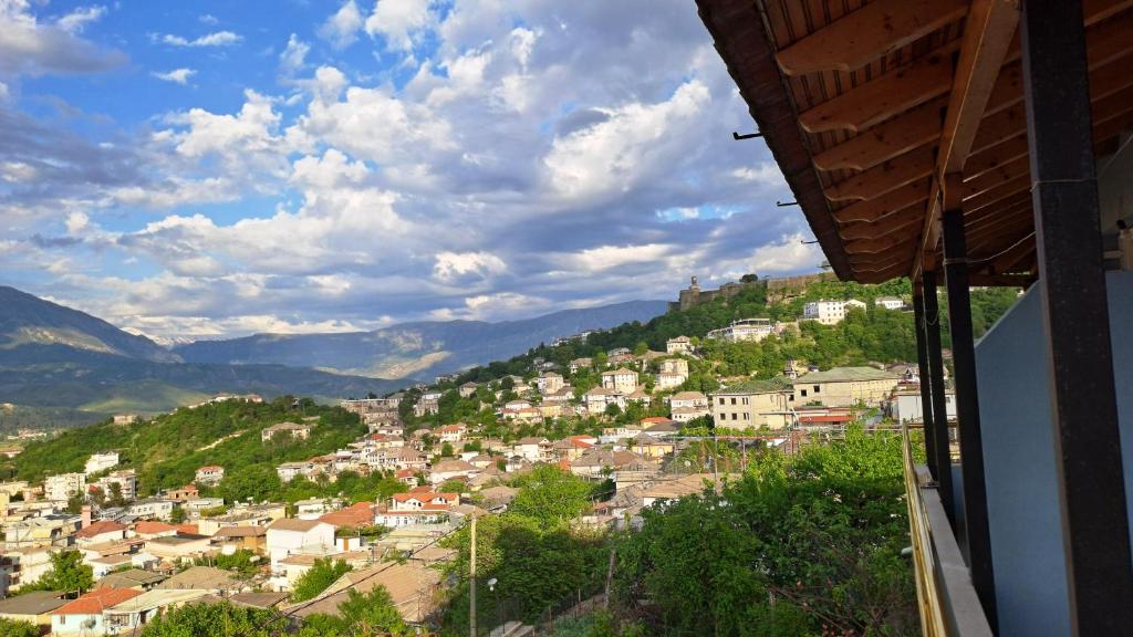 a view of a town on a hill with houses at Amari Rooms in Gjirokastër