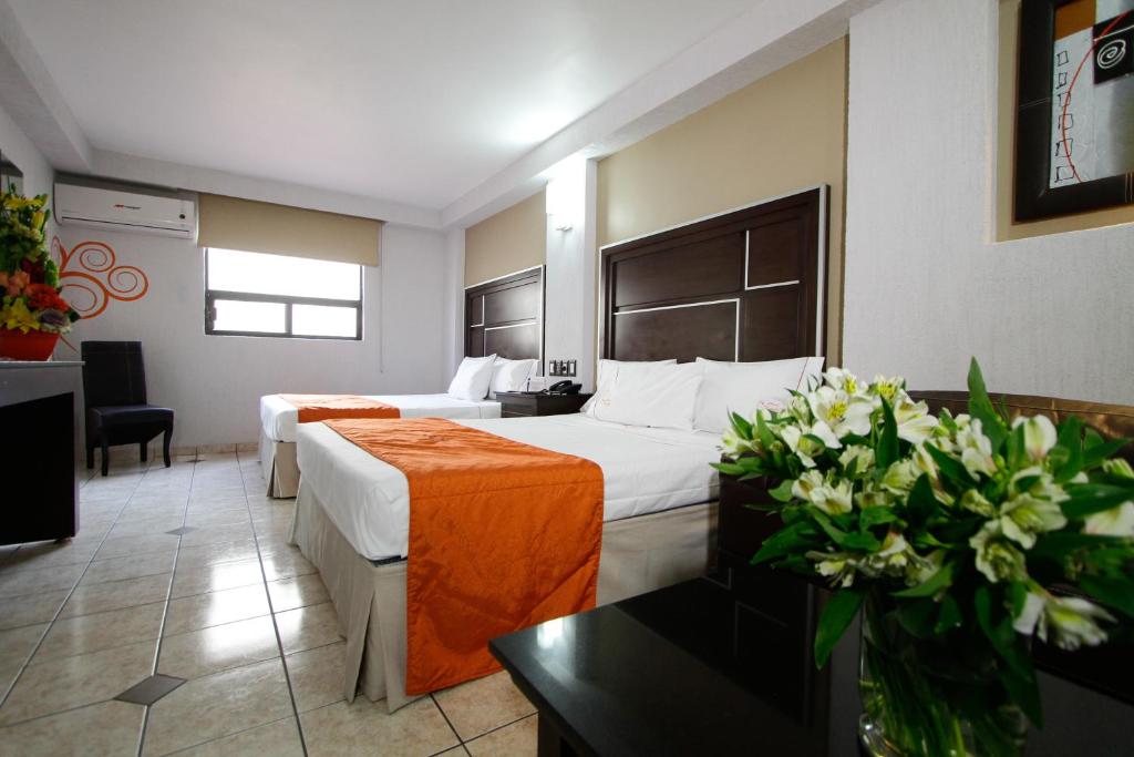 Postel nebo postele na pokoji v ubytování Hotel Estadio