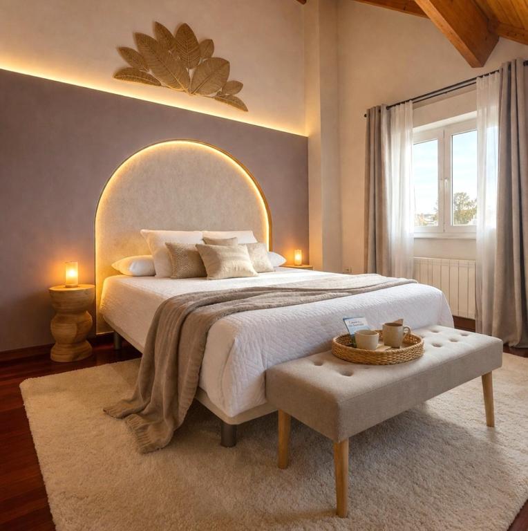 a bedroom with a large bed and a window at VILLA PANGEA - Guest House - Camino del Norte in Castro-Urdiales