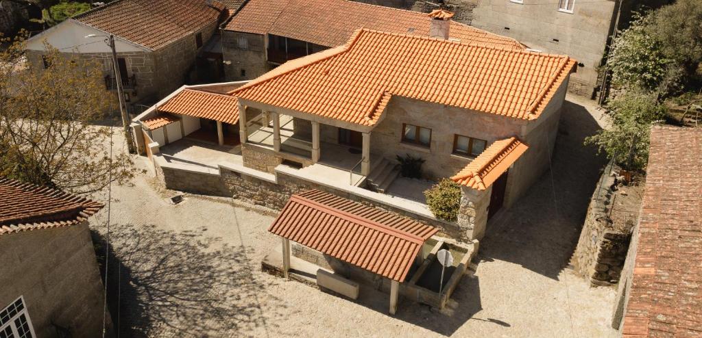 an overhead view of a house with orange roofs at Refugio do Couto in Cabeceiras de Basto