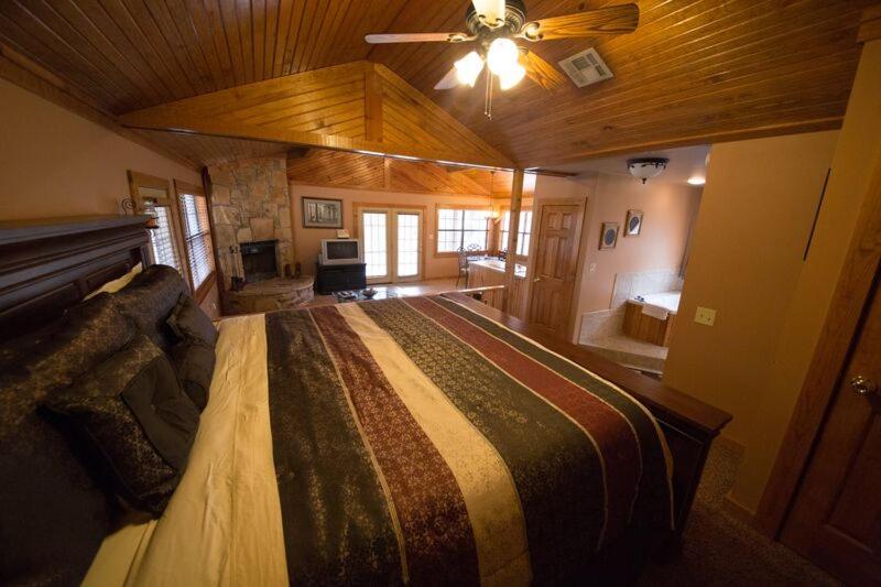 a bedroom with a large bed in a room at Long Lake Resort in Poteau