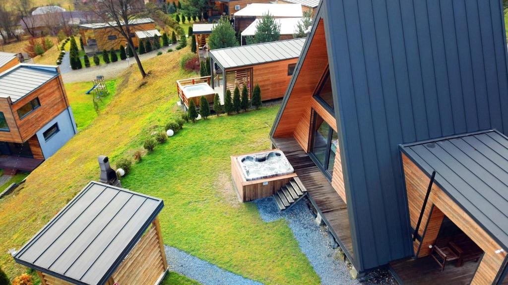 an aerial view of a house with a yard at KubiA in Slănic-Moldova