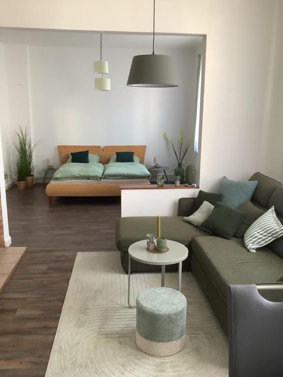 a living room with a couch and a table at Ruhrpott Liebe in Herten