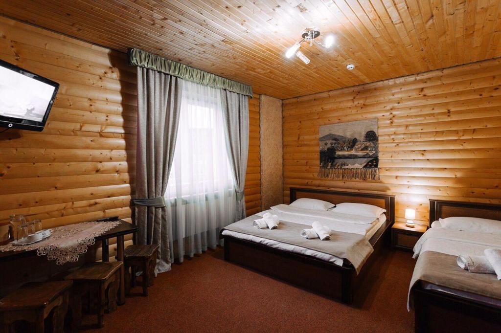 Postel nebo postele na pokoji v ubytování Hotel Marilen