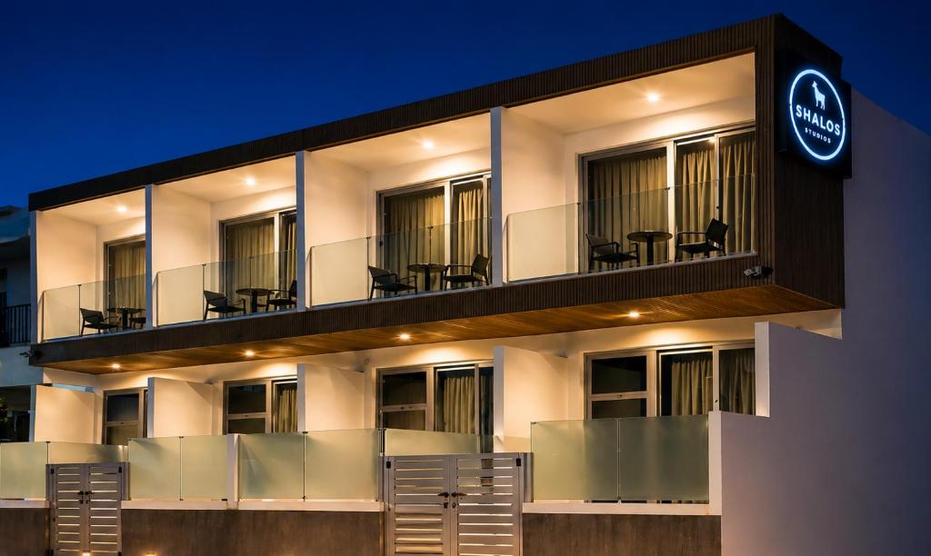 a building with a sign on the side of it at Shalos Studios - Cozy Central in Ayia Napa
