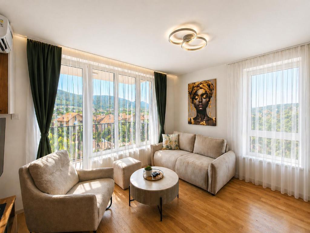 a living room with a couch and a table at Panorama Gold in Soko Banja