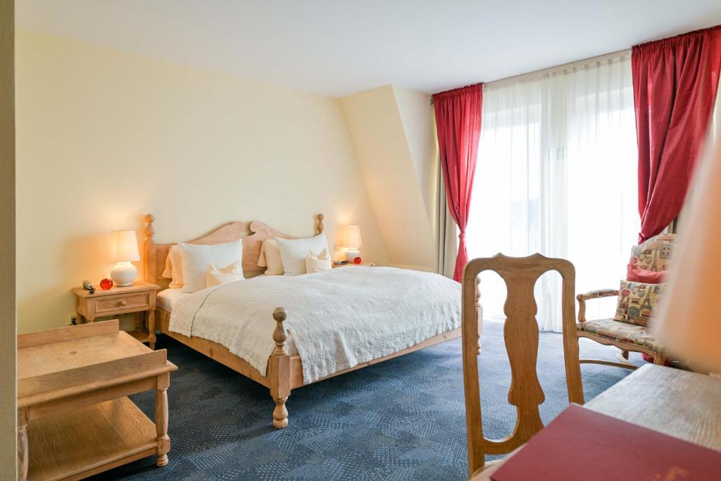 Giường trong phòng chung tại Hotel Lessing