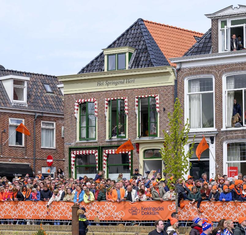 a large crowd of people in front of a building at B&B Suupmarkt in Dokkum