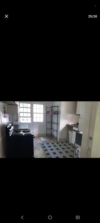 a kitchen with a stove top oven in a room at NH room rental in Akron