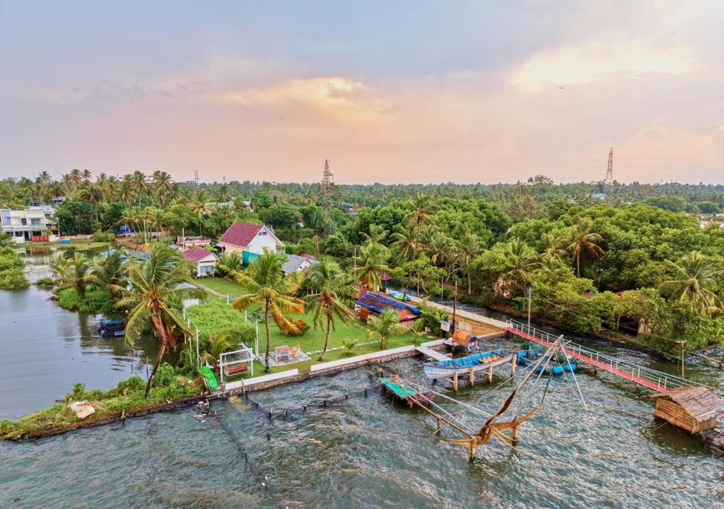 an aerial view of a pirate ship in the water at JC Den Private Villas Kochi by VOYE HOMES in Cochin