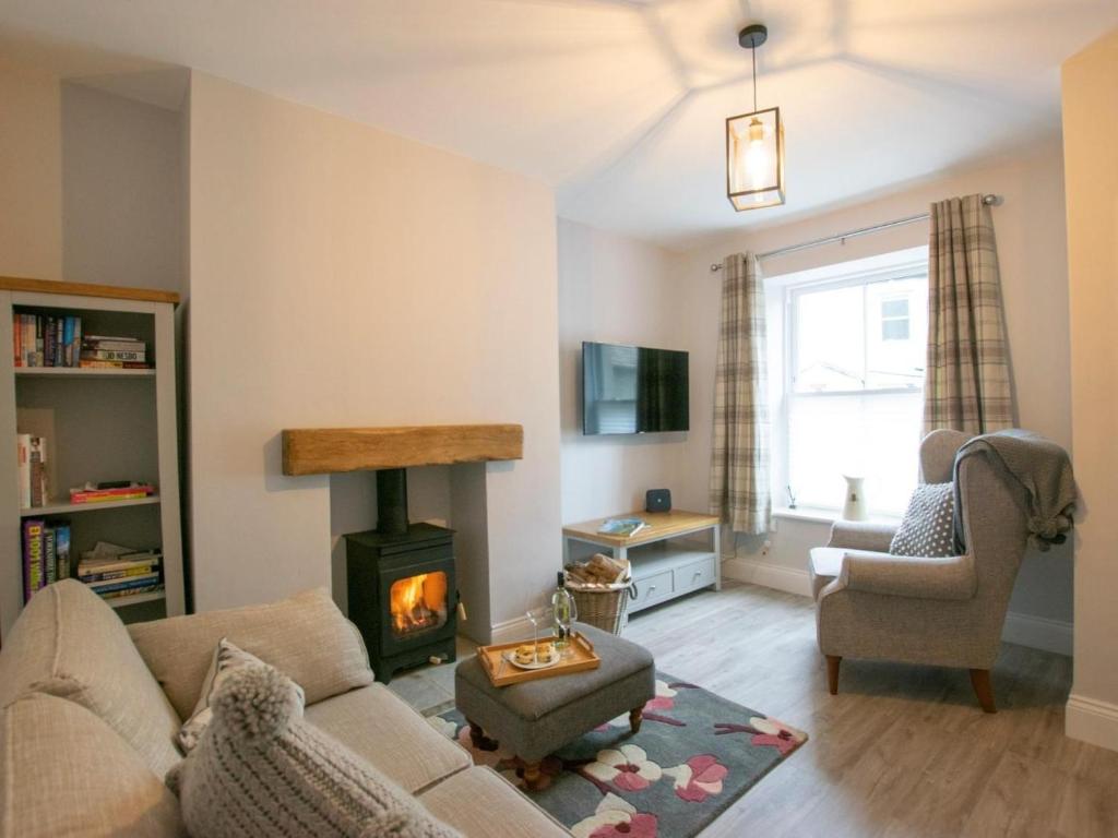 a living room with a couch and a fireplace at 2 Bed in Skipton oc-75646 in Grassington