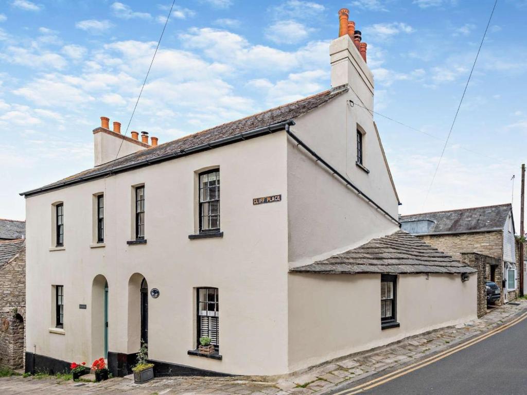 an old white building on the side of a street at 3 Bed in Swanage oc-ic098 in Swanage