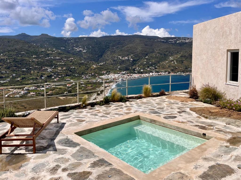 a swimming pool on top of a house at Galini House Private Villa in Andros in Órmos