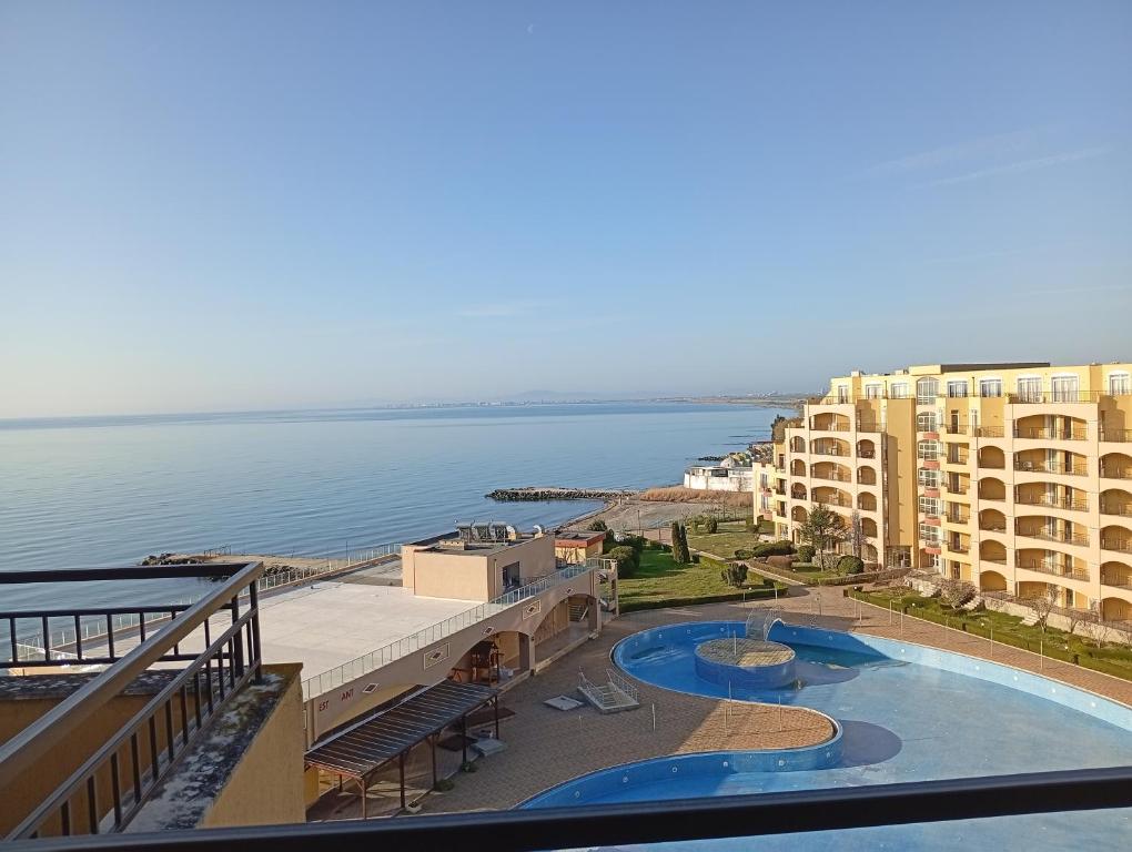 a view of a resort with a swimming pool and the ocean at Midia Resort Aheloy in Aheloy