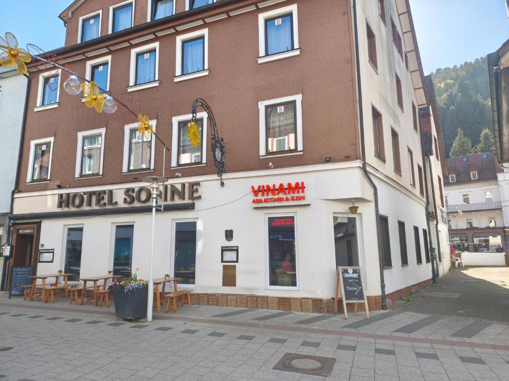 a building with a hotel entrance on a street at Vinami Hotel - Bad Wildbad in Bad Wildbad