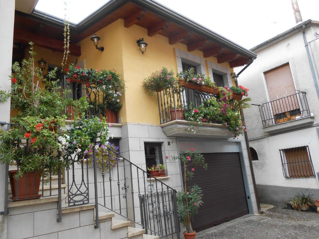 a building with flower boxes on the balconies at I QuattroGioielli in SantʼAngelo le Fratte