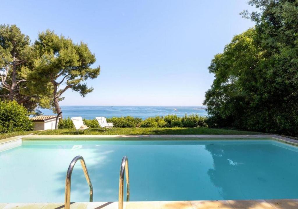 a swimming pool with a view of the ocean at Villa Krizia - Ancona, meravigliosa villa con piscina vista mare in Ancona