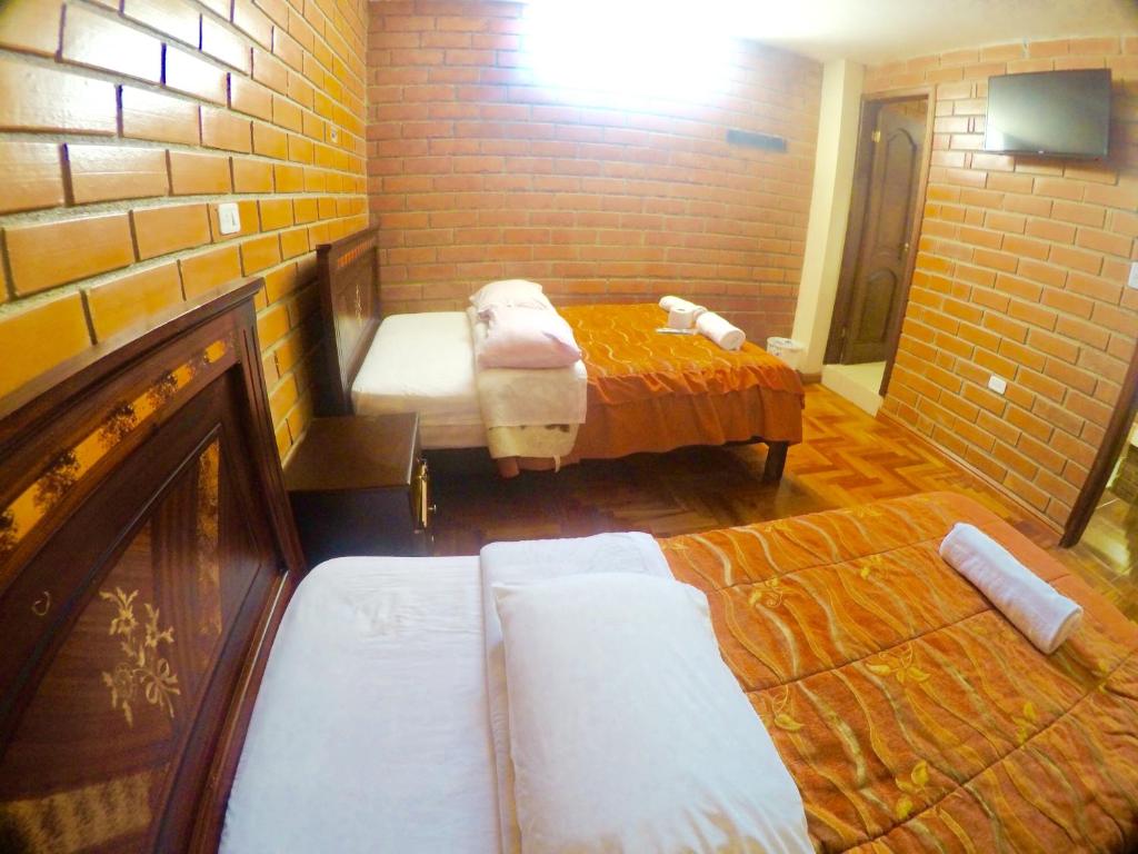 Postel nebo postele na pokoji v ubytování Hostal Nomada