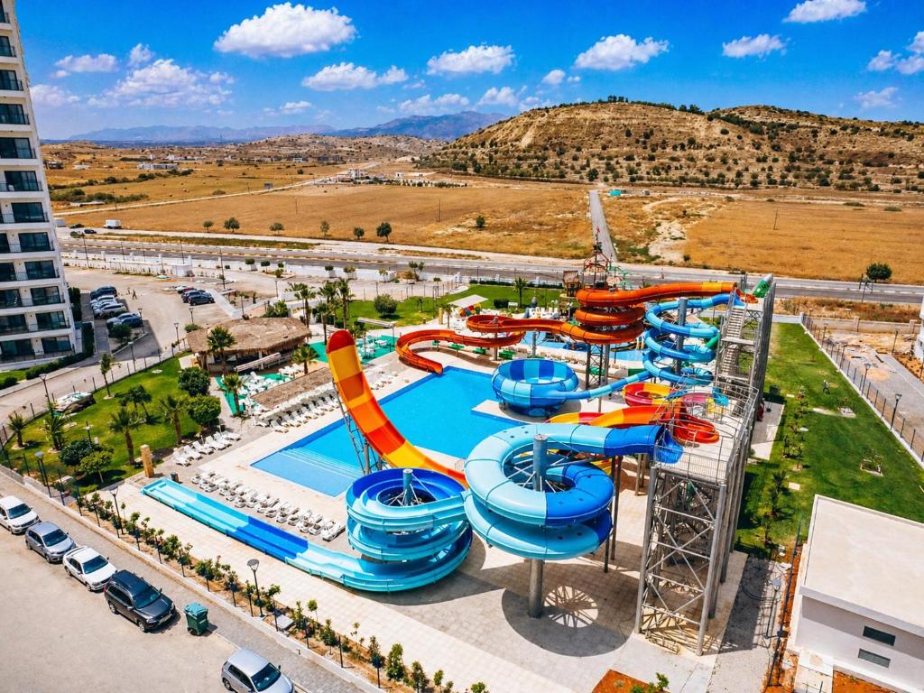 an image of a water park with a water slide at Caesar Blue Collection Nothern Cyprus Family Bedroom Suites in Ayios Dhometios