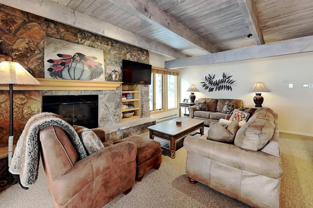 a living room with two couches and a fireplace at Timberline Condominiums 3 Bedroom Deluxe Unit D2E in Snowmass Village