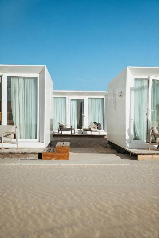 a rendering of a house with windows and furniture at Lua Beach House in Zandvoort