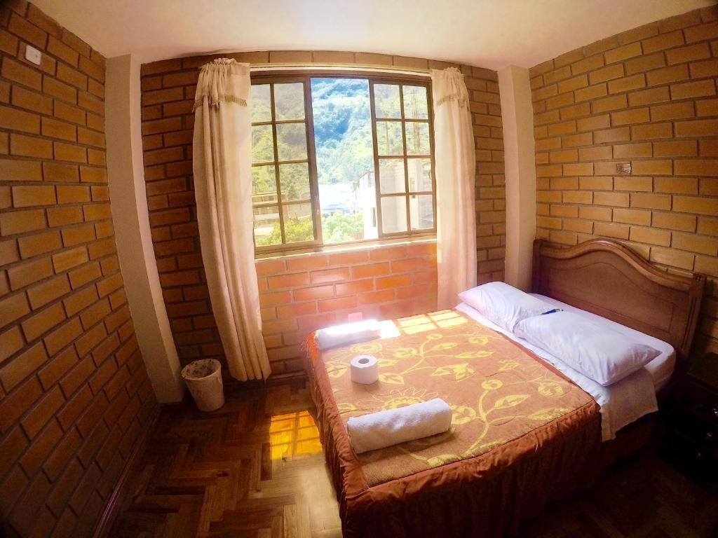 Postel nebo postele na pokoji v ubytování Hostal Nomada