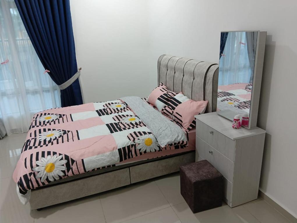 a small bedroom with a bed with a mirror at SD Homestay in Bachok