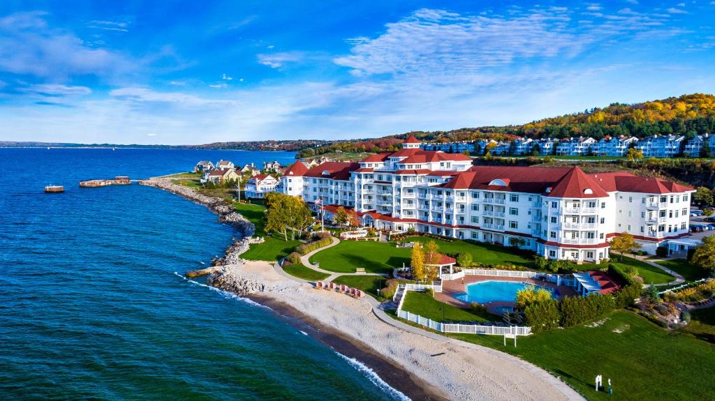an aerial view of a resort on the shore of the water at Inn at Bay Harbor in Petoskey