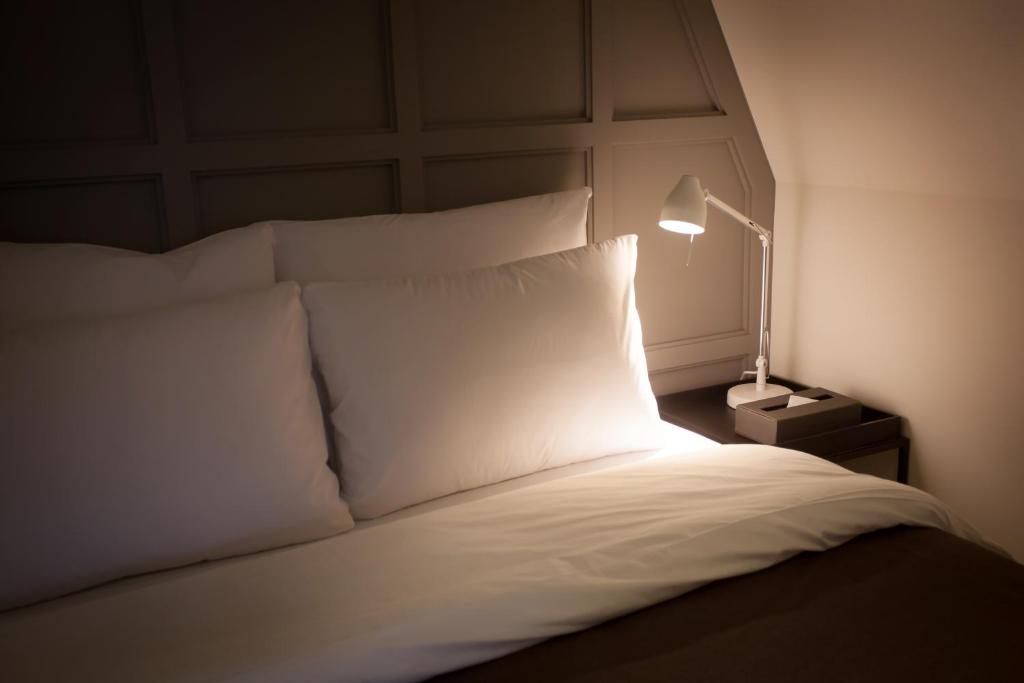Postel nebo postele na pokoji v ubytování Hotel Gaden