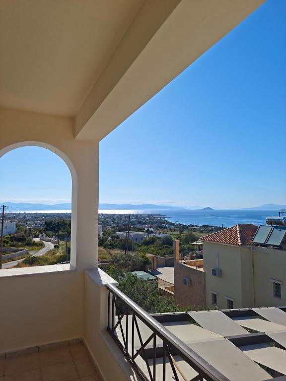 a balcony with a view of the ocean at Vista Mare Aegina in Kipséli